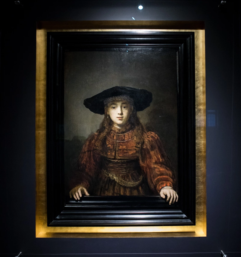 Rembrandt van Rijn - Dziewczyna w ramie obrazu